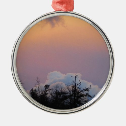 Powder blue clouds in a purple sky metal ornament