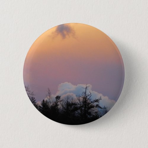 Powder blue clouds in a purple sky pinback button