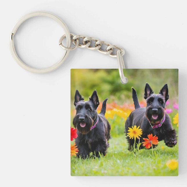 Prancing Scottish Terriers in grass and flowers Keychain (Front)