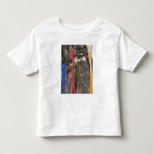 Prayer flags hang near Taktshang Toddler T-shirt