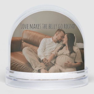 Pregnant new parents snow globe