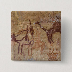 Prehistoric rock paintings with camels and pinback button