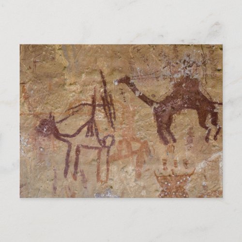 Prehistoric rock paintings with camels and postcard