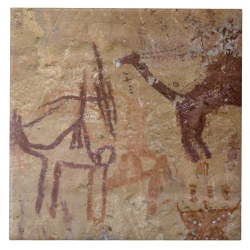 Prehistoric rock paintings with camels and tile