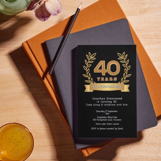 Premium '40 years of awesomeness' black & gold foil invitation (Stylish 40th birthday invitation, shown insiu on a desk with brown leather diary.)