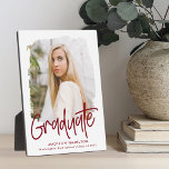 Preppy Burgundy Script Graduation Photo Plaque<br><div class="desc">Celebrate your graduate's achievement with a custom graduation photo keepsake. The plaque features the graduate's photo inside of a white textured mask frame with "Graduate" in a burgundy handwritten script. Personalize the graduation photo plaque by adding the graduate's name,  school,  and graduation year.</div>