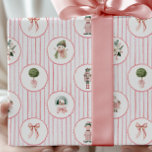 Preppy Grandmillennial Pink Nutcracker Christmas Wrapping Paper<br><div class="desc">Preppy grandmillennial Christmas wrapping paper with vintage pink stripes and nostalgic Victorian illustrations adds timeless charm and style to your holiday gift presentation. This elegant design features diagonally striped pastel pink and white backgrounds adorned with scalloped circles filled with antique-inspired artwork, including classic children in festive clothing, ribbon bows, topiary...</div>