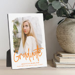 Preppy Orange Script Graduation Photo Plaque<br><div class="desc">Celebrate your graduate's achievement with a custom graduation photo keepsake. The plaque features the graduate's photo inside of a white textured mask frame with "Graduate" in an orange handwritten script. Personalize the graduation photo plaque by adding the graduate's name,  school,  and graduation year.</div>