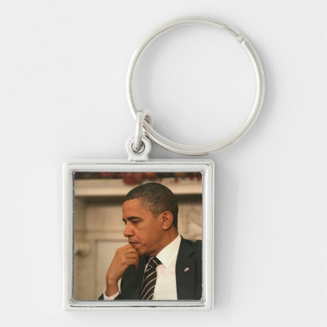 President Barack Obama reflects as he meets Keychain (Front)