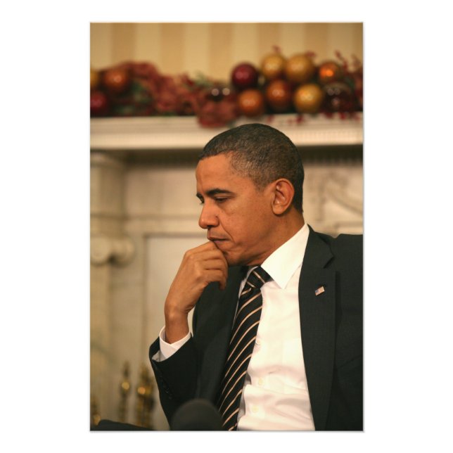 President Barack Obama reflects as he meets Photo Print (Front)
