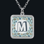 Pretty Blue Shell Starfish Sea Pattern Monogram Silver Plated Necklace<br><div class="desc">Add your own monogram / initial to this pretty, blue and cream seashell and starfish pattern. It conjures up images of the beach and summer. There are five varieties of shells in the design and one starfish. Perfect for nautical / beach / ocean / coastal theme style and decor. The...</div>