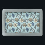 Pretty Blue Shell Starfish Sea Pattern Rectangular Belt Buckle<br><div class="desc">This pretty, blue and cream seashell and starfish pattern conjures up images of the beach and summer. There are five varieties of shells in the design and one starfish. Perfect for nautical / beach / ocean / coastal theme style and decor. The light blue background color can be customized to...</div>
