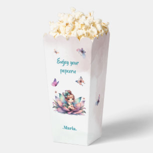 Pretty fairy sitting inside flower favor boxes