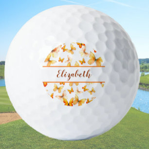 Pretty orange butterfly with custom name ladies golf balls