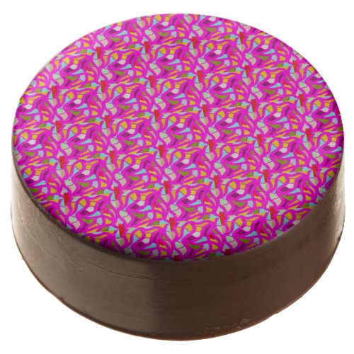 Pretty patterns in pink and rainbow colors chocolate covered oreo