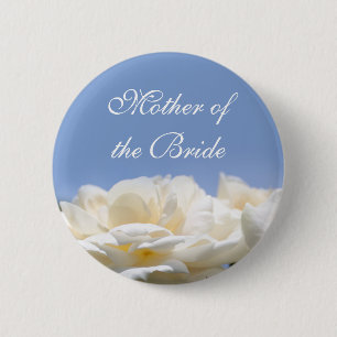 Pretty pure white rose flower button for weddings.