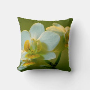 pretty white orchid flower in green. Floral garden Throw Pillow