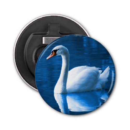 Pretty white swan floating on a blue lake bottle opener