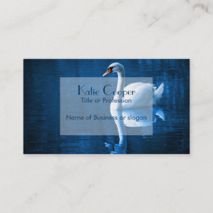 Pretty white swan floating on a blue lake business card