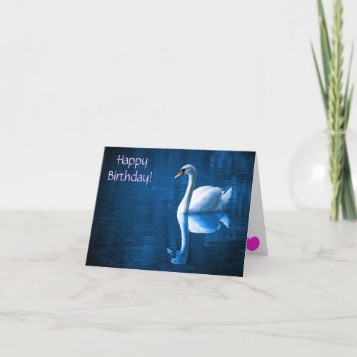 Pretty white swan floating on a blue lake card