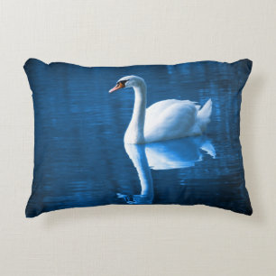 Pretty white swan floating on a blue lake decorative pillow