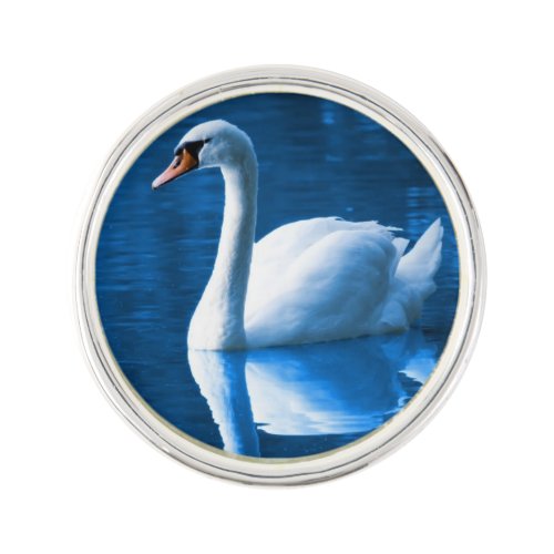 Pretty white swan floating on a blue lake lapel pin