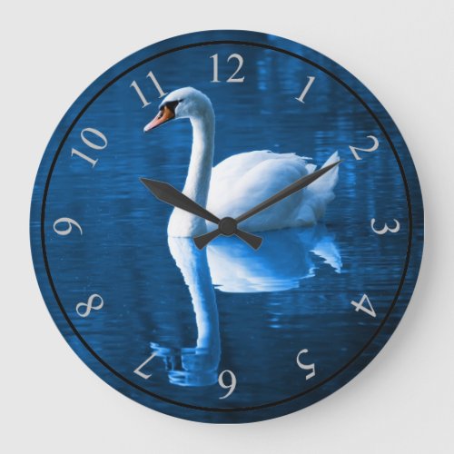 Pretty white swan floating on a blue lake large clock