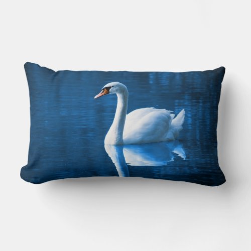 Pretty white swan floating on a blue lake lumbar pillow