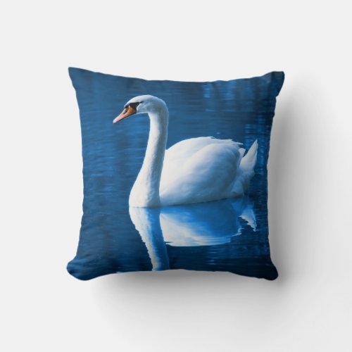 Pretty white swan floating on a blue lake throw pillow