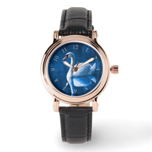 Pretty white swan floating on a blue lake watch