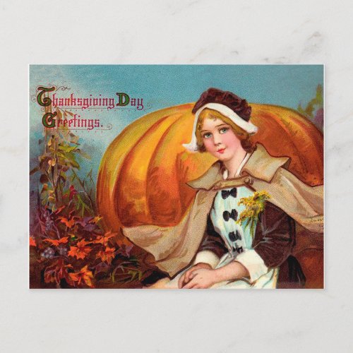 Pretty young woman with a big pumpkin thanksgiving postcard