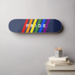 PRIDE Diagonal LGBT Rainbow Stripes on Navy Blue Skateboard<br><div class="desc">Celebrate LGBTQ Pride with diagonal rainbow stripes with the word PRIDE in bold white typography between and partially overlapping the colored stripes on a navy blue background. Red, orange, yellow, green, blue, and violet angled lines go from left to right. To see the modern gay pride design on other items,...</div>