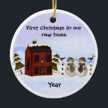 Primitive - First Christmas in our New Home Ceramic Ornament<br><div class="desc">This primitive style ornament will surely be one of your favorites. Above a red saltbox colonial house it says "First Christmas in our New Home" and has a snowman couple standing out front. Below them it has the year. On the back side is another snow couple and a place for...</div>