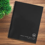 Professional Black & White Monogram Initial Notebook<br><div class="desc">Modern notebook features a minimal design in a classic black and white color palette. Custom name presented in the lower right hand corner in stylish simple font with a complimentary minimal monogram medallion. Shown with a custom name and monogram initial on the front in modern typography, this personalized business notebook...</div>