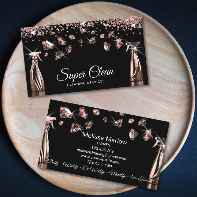 Professional House Cleaning Housekeeping Business Card (two rose gold house cleaning spray bottles spraying diamonds, black background, luxury feel)