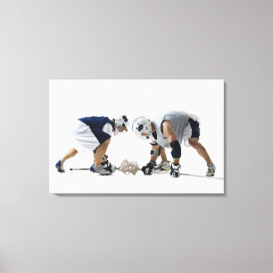 Profile of two young men playing lacrosse canvas print
