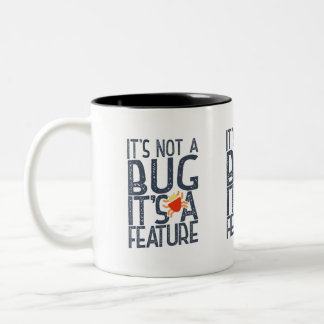 programmer funy - it's not a bug, it's a feature Two-Tone coffee mug