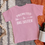 Promoted to Big Sister Pregnancy Announcement Baby T-Shirt<br><div class="desc">Custom printed apparel personalized with "Promoted to Big Sister" graphic in trendy modern fonts with a boho arrow design. Perfect for a pregnancy announcement photo or a gift for older siblings when new baby arrives! Use the design tools to edit the colors or add your own text and photos to...</div>