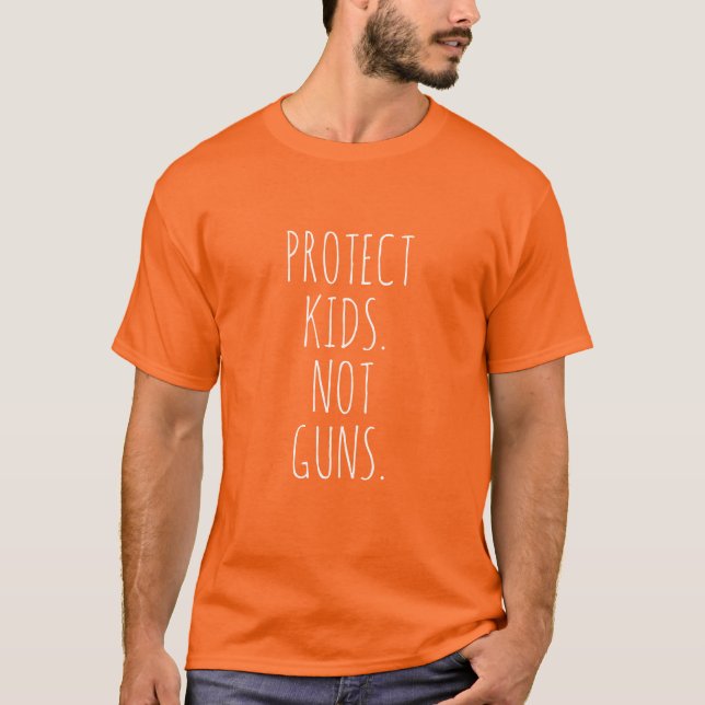 Protect kids Not guns orange white handwritten T-Shirt (Front)