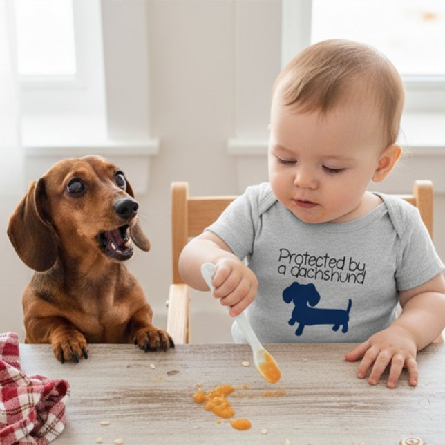 Protected by a Dachshund (blue) Baby Bodysuit (Protected by a dachshund - my wiener dog looks out for me and my shirt says so!)
