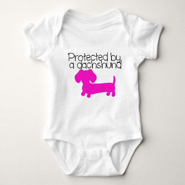 Protected by a Dachshund (pink) Baby Bodysuit (Front)