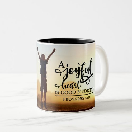 Proverbs 1722 A cheerful heart is good medicine Two_Tone Coffee Mug