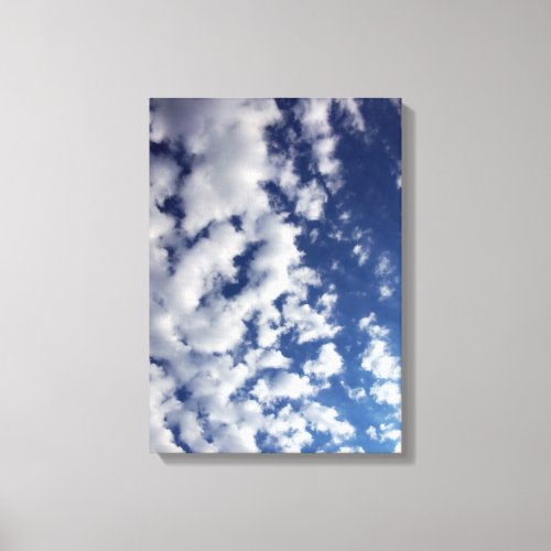 Puffy Clouds On Blue Sky Canvas Print