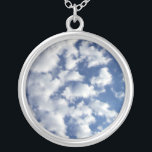 Puffy Clouds On Blue Sky Silver Plated Necklace<br><div class="desc">A bank of puffy white clouds breaks into small wispy pieces across the frame of the vertical photograph. The cloud cover is denser on the left and more sparse on the right, revealing a deep blue sky that is dark near the top of the photo and lighter near the bottom....</div>