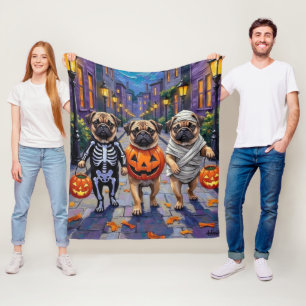 Pug Dogs Trick-or-Treating in Halloween Costumes Fleece Blanket