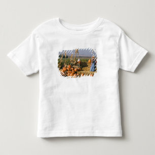 Pumpkin display with hay bales and scarecrows toddler t-shirt