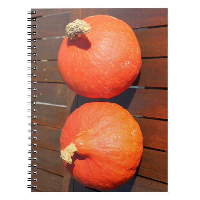 Pumpkins on a wooden table notebook (Front)