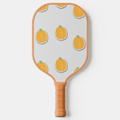 Pumpkins on gray pickleball paddle