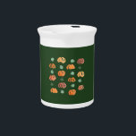 Pumpkins with Leaves Pitcher<br><div class="desc">The pattern with ripe and green pumpkins and leaves is drawn in watercolors and placed on a myrtle background. It's a cheerful print for your home.</div>