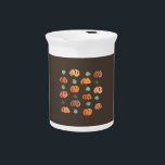 Pumpkins with Leaves Pitcher<br><div class="desc">The pattern with ripe and green pumpkins and leaves is drawn in watercolors and placed on a taupe background. It's a cheerful print for your home.</div>